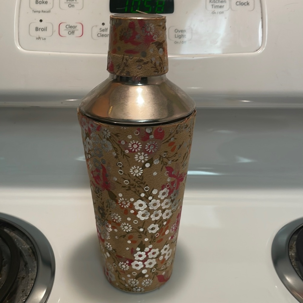 Martini shaker, only used once. Shaker has detailed, beautiful floral design.